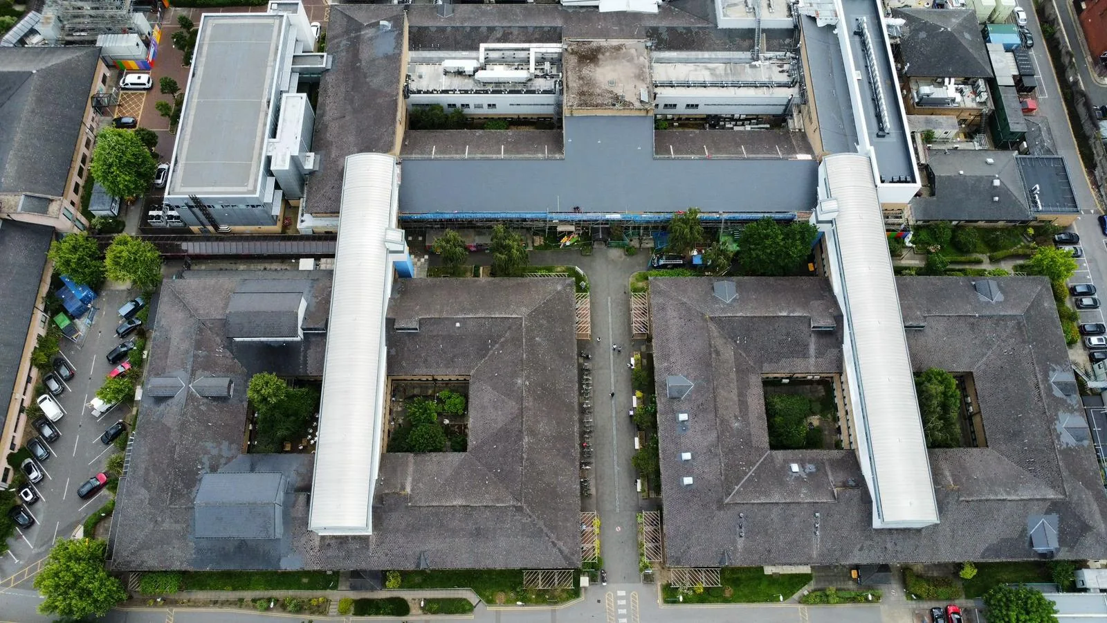 Aerial drone view of a large commercial flat roofing project by Astral Roofing in Hertfordshire
